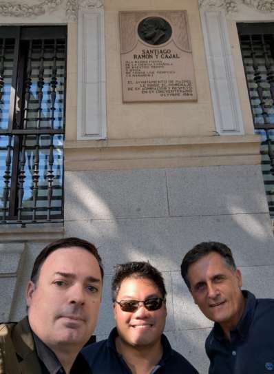 David Vivancos, Hon Weng Chong and Jimmy Pons standing beneath the memorial plaque at the house where Cajal lived and died, Madrid.